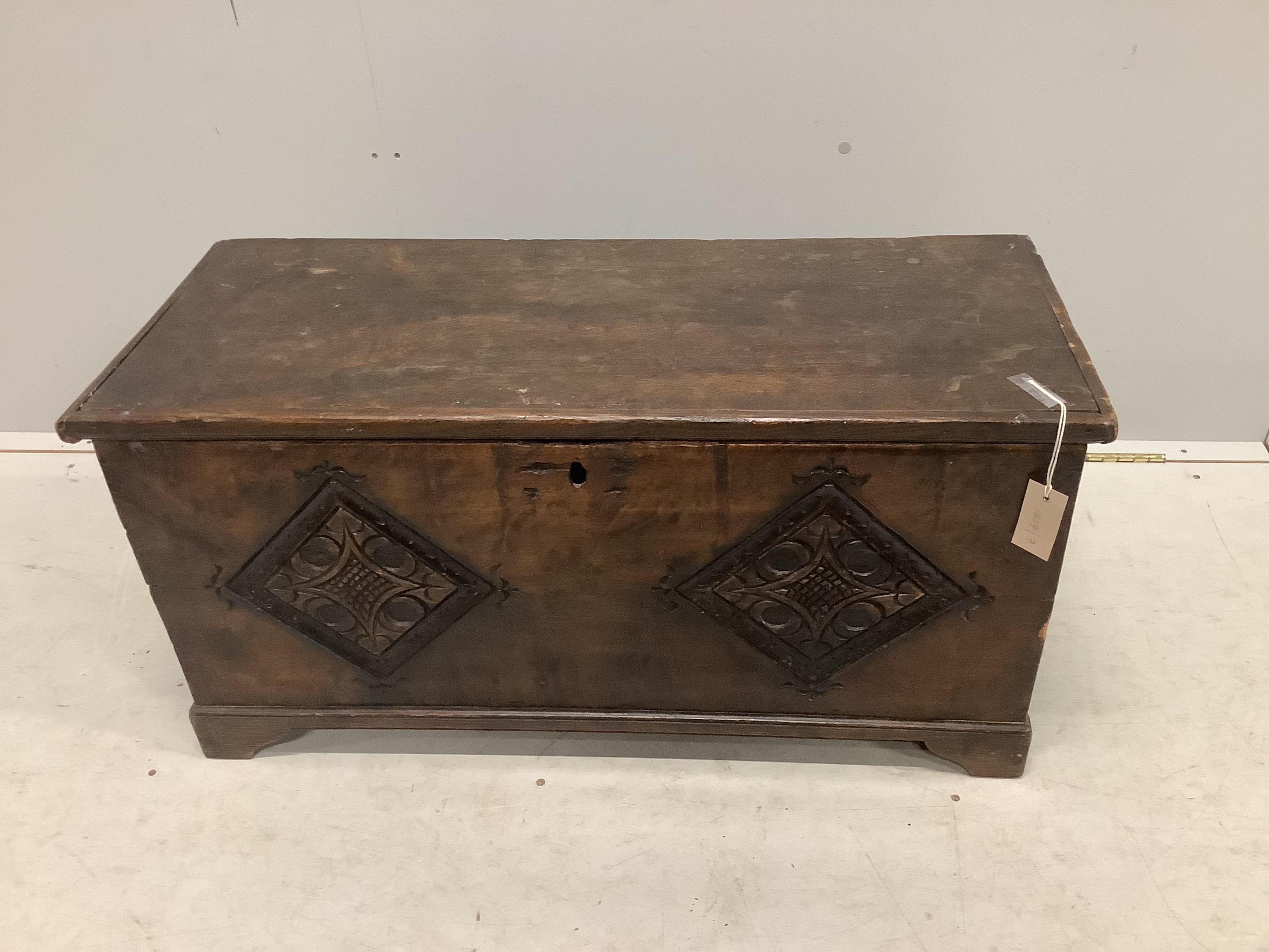 A small 17th century style carved fruitwood six plank coffer, width 91cm, depth 38cm, height 46cm. Condition - fair